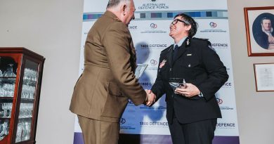 Major General Douglas, Head of Joint Support Services Division congratulates Megan Stifler, Chief Commissioner of the NSW Fire and Rescue Service. Photo by Oscar Coleman