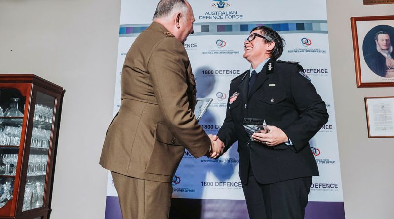 Major General Douglas, Head of Joint Support Services Division congratulates Megan Stifler, Chief Commissioner of the NSW Fire and Rescue Service. Photo by Oscar Coleman