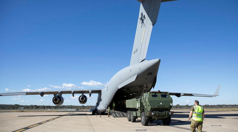 A high mobility artillery rocket system is loaded on C-17A Globemaster in preparation for Exercise Highball at RAAF Base Amberley, Queensland. Story by Major Cam Jamieson. Photo by Leading Aircraftwoman Taylor Anderson.