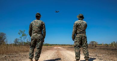 Marine Corps 1st Lieutenant Kevin Arbeznik, left, and Gunnery Sergeant Emmanuel Alvarado observe an airdrop from a RAAF C-27J Spartan at the Mount Bundy Training Area, Northern Territory. Story by Flight Lieutenant Claire Campbell. Photo by Leading Aircraftman Chris Tsakisiris