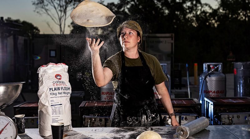Australian Army cook Corporal Samantha Kenafake, of 10th Force Support Battalion, prepares pizza for soldiers at Camp Growl, Shoalwater Bay Training Area, during Exercise Talisman Sabre 2023. Story by Captain Diana Jennings. Photos by Sergeant Sagi Biderman.