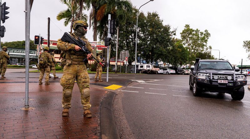 Australian Army Reserve soldiers from Battle Group Waratah patrol the main street of Ingham, Queensland, while carrying out protection operations as part of Exercise Talisman Sabre 2023. Story by Major Jesse Robilliard. Photos by Corporal Michael Currie.