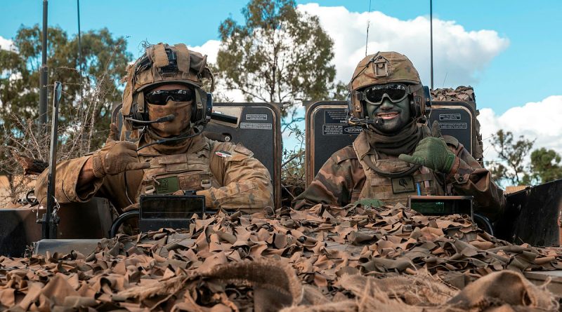 Australian Army Private Samuel Austen-Wilkins, left, and His Majesty's Armed Forces of Tonga Lance Corporal Sione Atoa mounted in an Australian Army Boxer combat reconnaissance vehicle during Exercise Talisman Sabre. Story by Major Roger Brennan. Photos by Corporal Nicole Dorrett.