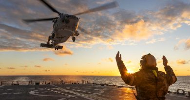 Leading Seaman Thomas Baskerville marshals a Japan Maritime Self-Defense Force SH-60K Super Auk, from JS Shiranui, to land on HMAS Brisbane during Exercise Malabar. Story by Lieutenant Marcus Middleton. Photos by Leading Seaman Matthew Lyall.