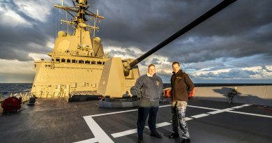 Commanding Officer HMAS Brisbane Commander Kingsley Scarce, Royal Australian Navy, right, with United States Navy Petty Officer 2nd Class Owen Buck on the forecastle of HMAS Brisbane during Exercise Malabar off the coast of NSW. Story by Lieutenant Marcus Middleton. Photo by Leading Seaman Matthew Lyall.