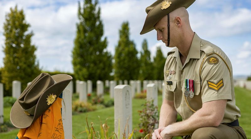 Australian Army Jonathan Church Good Soldiering Award ambassador Corporal Justin Wells, beside the headstone of Gunner William Tasker at Villers-Bretonneux Military Cemetery, Villers-Bretonneux France. Story and photos by Corporal Jacob Joseph.