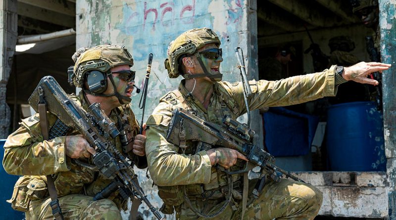 Australian Army soldier Corporal Brandon Camilleri, right, delivers quick orders during a bilateral air assault exercise with the Armed Forces of the Philippines on Exercise Alon in the Philippines. Story by Captain Joanne Leca. Photos by Lance Corporal Riley Blennerhassett.