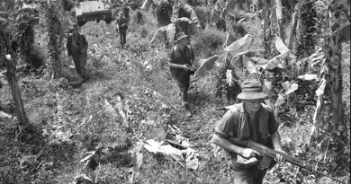 Soldier from the 6th Battalion, Royal Australian Regiment, (6RAR), move into their first operation against the Viet Cong in South Vietnam. The infantry occupied a large Viet Cong village during the mission, code-named Operation Enoggera, in the last week of June 1966. Photo by William 'Billy' Cunneen. AWM CUN/66/0504/VN