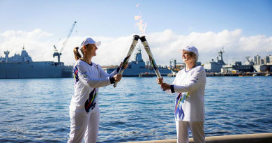 Commander Cindy Jenkins, left, during her stint as a torch bearer in the Legacy Centenary Torch Relay, to recognise 100 years of the Legacy Promise. Story by Captain Kristen Daisy Cleland. Photo by Callum Smith.