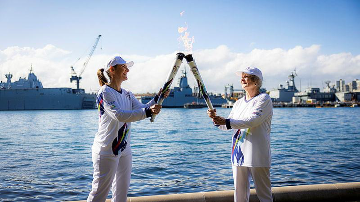 Commander Cindy Jenkins, left, during her stint as a torch bearer in the Legacy Centenary Torch Relay, to recognise 100 years of the Legacy Promise. Story by Captain Kristen Daisy Cleland. Photo by Callum Smith.