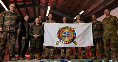 International participants of Exercise Talisman Sabre, representing the Combat Training Centres of France, Canada and the UK, with Colonel Ben McLennan (ADF), far right. Story by V. Photo by Corporal Julia Whitwell.
