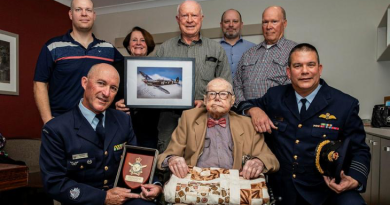 Senior ADF Officer RAAF Base Amberley, Group Captain Dennis Tan (right), and Warrant Officer Glenn Lyons (left) with Air Force veteran John Shoesmith and his family to celebrate his 100th birthday. Story by Flight Lieutenant Rob Hodgson. Photo by Leading Aircraftwoman Taylor Anderson.