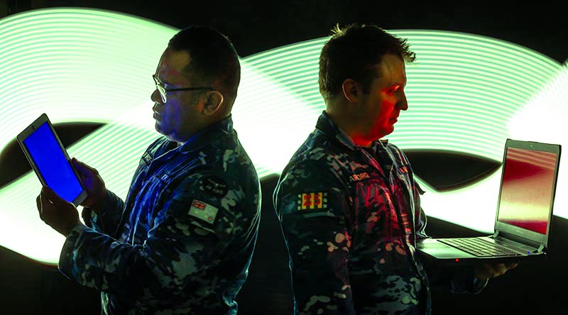 Cyber warfare analyst Leading Aircraftman Netani Tukana and cyber warfare officer Squadron Leader James Haddy from No. 462 Squadron at RAAF Base Edinburgh, South Australia. Photo by Leading Aircraftman Sam Price.