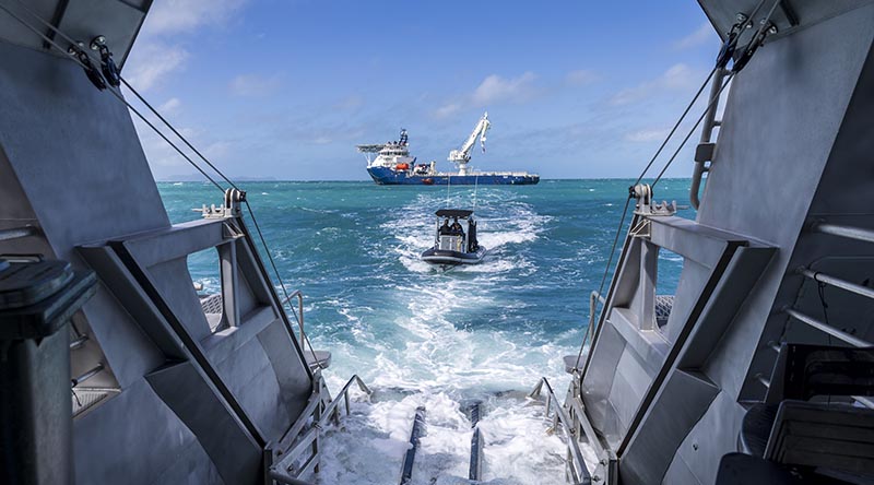 Queensland Police Service assist Royal Australian Navy Mine Warfare and Clearance Diving Task Group alongside Australian Defence Vessel Reliant, during the MRH-90 Taipan recovery in the Whitsunday Islands. Photo by Corporal Lisa Sherman.