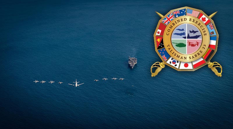 Exercise Talisman Sabre Air Task Group aircraft fly in formation over the USS Ronald Regan in the Timor Sea while participating in Exercise Talisman Sabre 23.