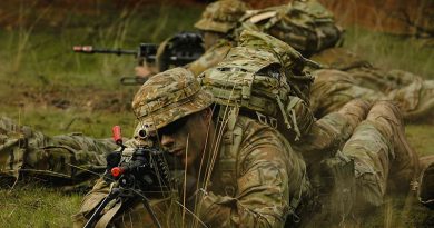 An Army recruit from 1st Recruit Training Battalion Kapooka takes a sight picture through an F89 Minimi at Blamey Barracks Kapooka, NSW. Photos by Leading Aircraftman Adam Abela.