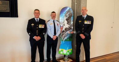 Pilot Officer Shane Collins stands with Commanding Officer, Officer Training School (OTS) Wing Commander Garth Herriot and OTS Squadron Warrant Officer, Warrant Officer Scott Robbins alongside the artwork Pilot Officer Shane Collins painted during his course. Story by Flight Lieutenant Steffi Blavius. Photos by Sergeant Damien Draeger.