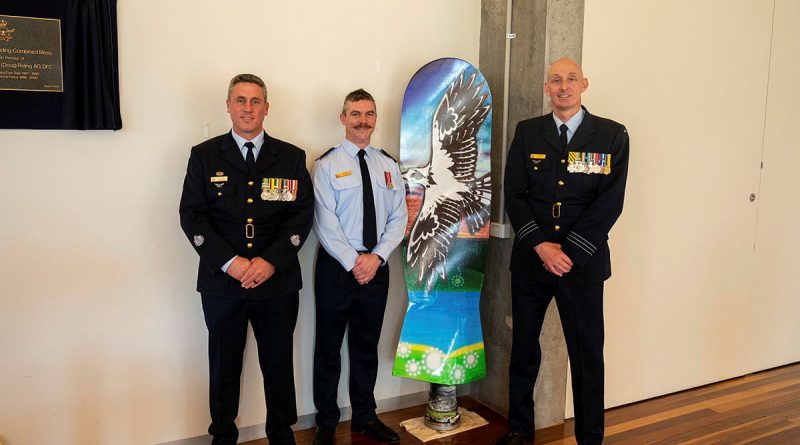 Pilot Officer Shane Collins stands with Commanding Officer, Officer Training School (OTS) Wing Commander Garth Herriot and OTS Squadron Warrant Officer, Warrant Officer Scott Robbins alongside the artwork Pilot Officer Shane Collins painted during his course. Story by Flight Lieutenant Steffi Blavius. Photos by Sergeant Damien Draeger.