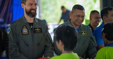 RAAF Wing Commander Sean Hamilton and Royal Thai Air Force Group Captain Sithipol Pomtri pass gifts to students during Exercise Thai Boomerang. Story by Flight Lieutenant Rob Hodgson. Photos by Leading Aircraftman Ryan Howell.
