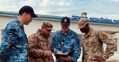 From left, RAAF engineer and interpreter Flight Lieutenant Burentogtokh Altantsetseg, Mongolian Armed Forces Lieutenant Tsendendamba, RAAF engineer Warrant Officer Andrew Warmington and US Pacific Air Force Staff Sergeant Reginald Madison discuss renovation planning at the Tsenser community hospital in Arkhangai State, Central Mongolia. Story by Flight Lieutenant Rachael Blake.