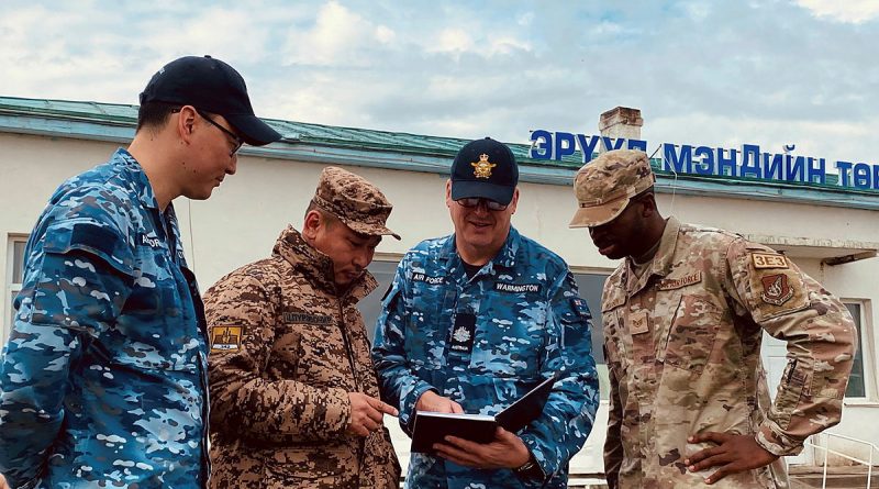 From left, RAAF engineer and interpreter Flight Lieutenant Burentogtokh Altantsetseg, Mongolian Armed Forces Lieutenant Tsendendamba, RAAF engineer Warrant Officer Andrew Warmington and US Pacific Air Force Staff Sergeant Reginald Madison discuss renovation planning at the Tsenser community hospital in Arkhangai State, Central Mongolia. Story by Flight Lieutenant Rachael Blake.