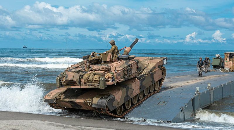 An Australian Army M1A1 Abrams tank from the 2nd Cavalry Regiment hits the shore during a combined amphibious assault activity on Exercise Alon in the Philippines. Story by Squadron Leader Courtney Jay. Photos by Lance Corporal Riley Blennerhassett.