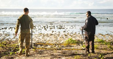 Australian Army explosive ordnance disposal technician Corporal Joel Macmillan, left, and Royal Solomon Islands Police Force Constable Armstrong Ragoso survey the coastline using metal detection equipment during Operation Render Safe, Nauru. Story by Captain Karam Louli. Photos by Corporal Sam Price.