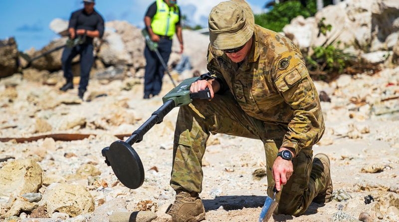 Australian Army Lance Corporal Lobenzo Humberto Meneses inspects an area of interest during Operation Render Safe, Nauru. Story by Captain Karam Louli. Photos by Corporal Sam Price.