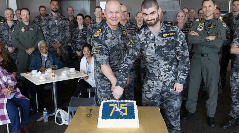 Commanding Officer HMAS Albatross, Captain Scott Palmer and the youngest sailor aboard, Able Seaman Casey Merriman slice a birthday cake during 75th anniversary celebrations for HMAS Albatross. Story by Sub Lieutenant Jaclyn Bollock. Photos by Petty Officer Peter Thompson.