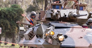 Defence Work Experience Program participants Alexandra Ibrahim and Angella Dcunha, of Saint Monica, get ready to go for a ride in an Australian light armoured vehicle during an open day for school students at Puckapunyal. Story by Captain Carlie Gibson. Photos by Corporal Michael Currie.