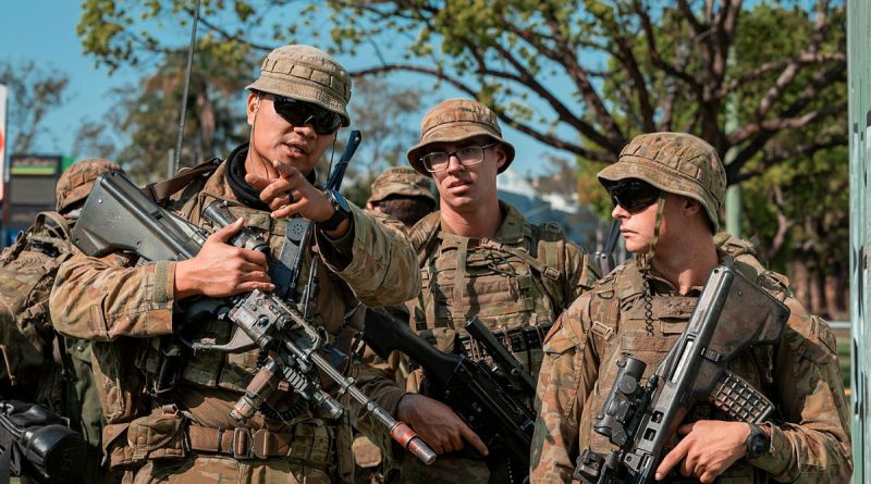 Soldiers of Combat Team Charlie from Battle Group Ram prepare to make entry into an abandoned section of Trinity College in Lismore as part of urban clearance training during Exercise Ever Ready Ram. Story by Captain Cody Tsaousis. Photos by Corporal Nicole Dorrett.