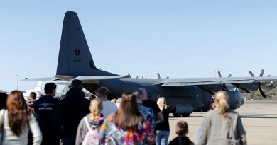 Families of 37 Squadron personnel prepare to board a C-130J Hercules for a flight during the squadron's family day at RAAF Base Richmond. Story by Tastri Murdoch. Photos by Corporal John Solomon.