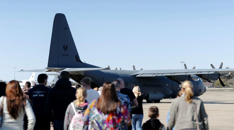 Families of 37 Squadron personnel prepare to board a C-130J Hercules for a flight during the squadron's family day at RAAF Base Richmond. Story by Tastri Murdoch. Photos by Corporal John Solomon.