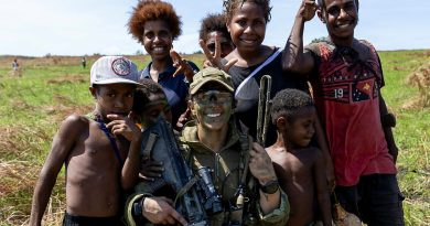 Australian Army officer Lieutenant Samantha May, of the 3rd Battalion, the Royal Australian Regiment, with local children in Papua New Guinea. Story by Captain Diana Jennings. Photos by Leading Aircraftwoman Emma Schwenke.