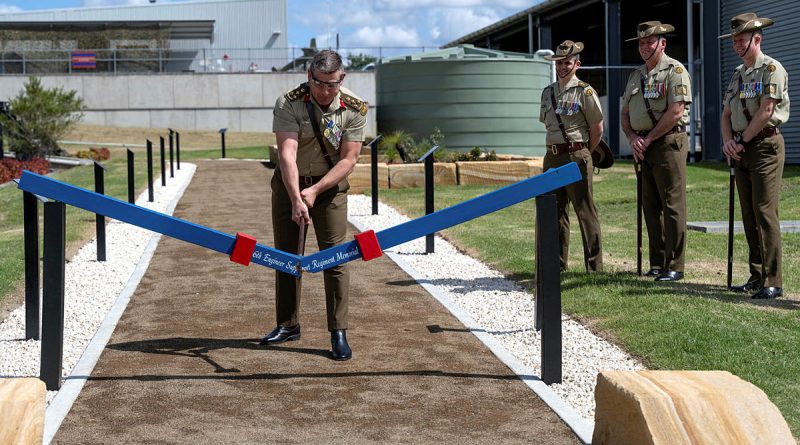 Commander 6th Brigade Brigadier Greg Novak uses the ceremonial axe to officially open the 6th Engineer Support Regiment Memorial Walk at RAAF Base Amberley, Queensland. Story by Captain Evita Ryan. Photos by Warrant Officer Class 2 Kim Allen.