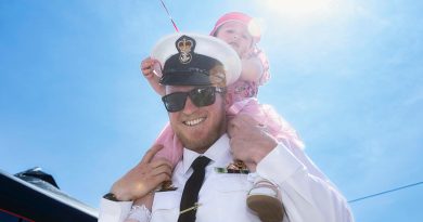 Petty Officer Roland Brew with his daughter at the Members and Family Day in HMAS Watson, Sydney. Story by Sub-Lieutenant James Murphy. Photos by Sittichai Sakonpoonpol.