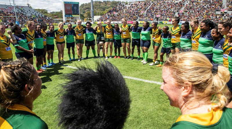 Members of the woman’s ADF Rugby League team form a huddle with the PNGDF Rugby League team after a friendly exhibition match at the Santos National Football Stadium, Port Moresby, PNG. Story by Squadron Leader Amanda Scott. Photos by Leading Seaman Matthew Lyall.