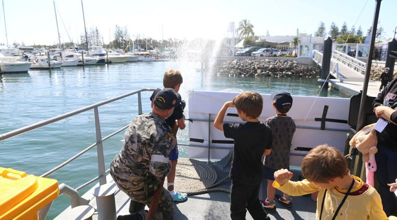 Leading Seaman Andrew Price demonstrates fire hose techniques during HMAS Maryborough’s open day. Story by Sub-Lieutenant Nicole Clough.