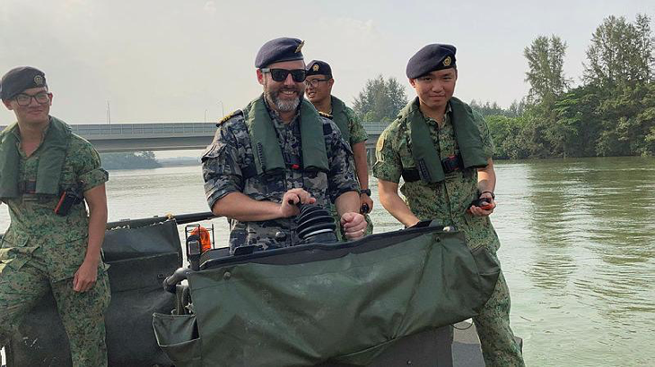 Lieutenant Commander Michael Booth (Staff College Student) operating a Singapore Armed Forces bridging lighter at Selatar Camp. Story by Commander Greg Swinden.