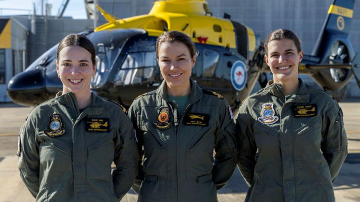 From left, Acting Sub-Lieutenant Chloe Wise, Acting Sub-Lieutenant Kathryn Boyd and Sub-Lieutenant Phoebe Curtis on the flightline at 723 Squadron, HMAS Albatross. Story by Sub-Lieutenant Marina Riley. Photo by Petty Officer Justin Brown.