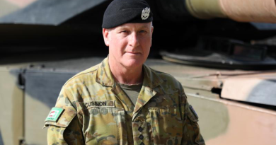 Australian Army officer Captain Robert Cussion with the M1A1 Main battle tank at RAAF Base Edinburgh, South Australia. Story by Jon Kroiter.