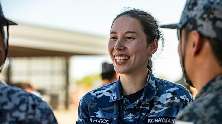 Pilot Officer Ema Kobayakawa talks with Japan Air Self-Defense Force personnel at RAAF Base Tindal, NT. Story by Flight Lieutenant Rachael Blake. Photo by Leading Aircraftwoman Taylor Anderson.