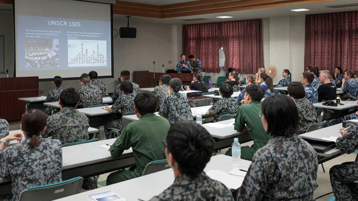 Flight Lieutenant Rosemary Callery addresses the attendees of the Women, Peace and Security networking event at Japan Air Self-Defense Force Komatsu Air Base during Exercise Bushido Guardian. Story by Flight Lieutenant Claire Campbell. Photo by Leading Aircraftman Samuel Miller.