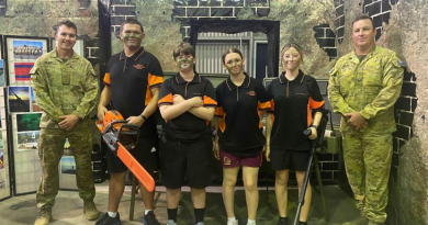 Students from Rockhampton State High School with Army soldiers Private Ben Blain and Corporal Steven Gross. Photo by Nel Archer.