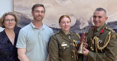 Katia Hoffmann, Luke Giacomin, Australian Army officers Major Jess Ward and Colonel Paul Graham with a fake vintage Western Australian University Regiment bugle.