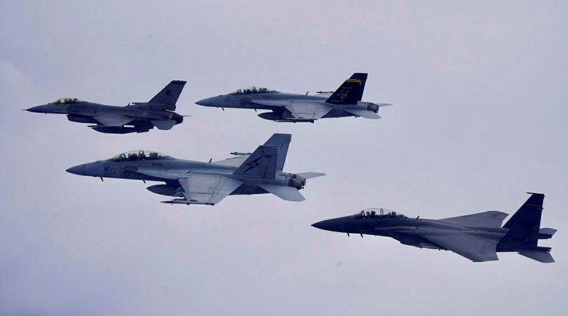 RAAF F/A-18F Super Hornet and Republic of Singapore Air Force, F-16 Fighting Falcon and F-15SG Strike Eagle aircraft fly in formation over Singapore. Story by Flight Lieutenant Rob Hodgson.