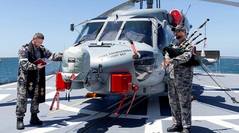Royal Australian Navy Chaplain Bradley Galvin, left, and Commanding Officer HMAS Toowoomba Commander Darin MacDonald during a blessing ceremony for the embarked MH-60R helicopter Valkyrie. Story and photos by Leading Seaman Ernesto Sanchez.