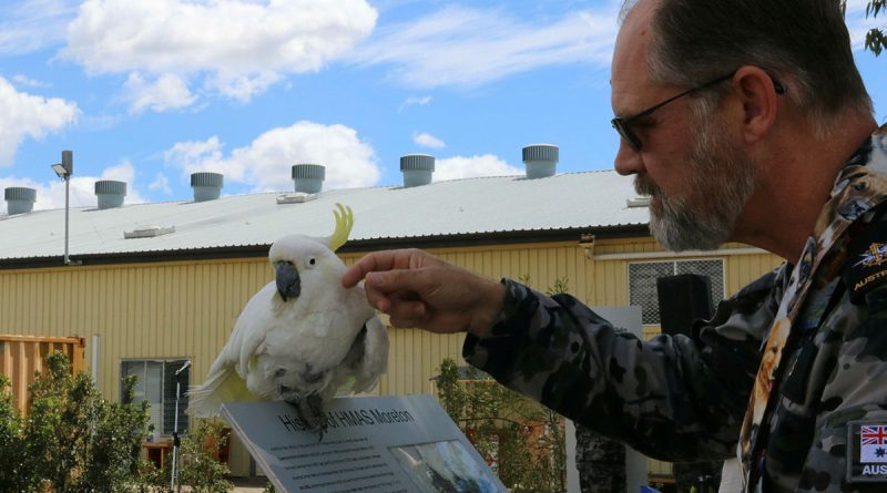 Chaplain Stephen Briggs with Bob the 54-year-old cockatoo at HMAS Moreton’s Blessing of the Pets. Story by Lieutenant Rebecca Williamson.