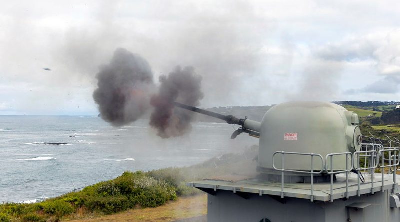 The 76mm medium calibre gun fires an 80-round burst at West Head gunnery range at Flinders, Victoria. Story by Richard Wilkins. Photos by Leading Seaman James McDougall.