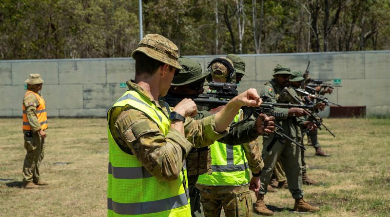 Australian Army soldiers instruct Republic of Fiji Military Forces members during a live shoot with the Australian EF88, as part of Exercise Coral Warrior at Gallipoli Barracks, Brisbane. Story by Captain Cody Tsaousis. Photos by Private Alfred Stauder.